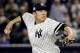 New York Yankees pitcher Masahiro Tanaka (19) delivers against the Cleveland Indians during the first inning in Game 3 of baseball's American League Division Series, Sunday, Oct. 8, 2017, in New York. (AP Photo/Frank Franklin II)