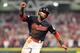 CLEVELAND, OH - OCTOBER 06: Austin Jackson #26 runs home to score the winning run on a single by Yan Gomes #7 of the Cleveland Indians to win the game 9 to 8 in the 13th inning during game two of the American League Division Series at Progressive Field on October 6, 2017 in Cleveland, Ohio. (Photo by Jason Miller/Getty Images)