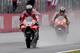 Ducati rider Andrea Dovizioso of Italy (L) flashes thumb-up while receiving a checkered flag ahead of Honda rider Marc Marquez of Spain (R) during the MotoGP Japanese Grand Prix at Twin Ring Motegi circuit in Motegi, Tochigi prefecture on October 15, 2017. / AFP PHOTO / TOSHIFUMI KITAMURA (Photo credit should read TOSHIFUMI KITAMURA/AFP/Getty Images)