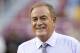 Al Michaels walks onto the field prior to an NFL football game between the Oakland Raiders and Washington Redskins, Sunday, Sept. 24, 2017, in Landover, Md. (AP Photo/Mark Tenally)