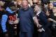 UFC president Dana White, center, intervenes as Floyd Mayweather Jr., left, and Conor McGregor exchange words during a news conference at Staples Center Tuesday, July 11, 2017, in Los Angeles. The two will fight in a boxing match in Las Vegas on Aug. 26. (AP Photo/Jae C. Hong)