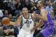 Utah Jazz guard Dante Exum (11) drives around Sydney Kings forward Perry Ellis, right, during the second half of a preseason NBA basketball game Monday, Oct. 2, 2017, in Salt Lake City. (AP Photo/Rick Bowmer)