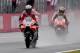 Ducati rider Andrea Dovizioso of Italy (L) flashes thumb-up while receiving a checkered flag ahead of Honda rider Marc Marquez of Spain (R) during the MotoGP Japanese Grand Prix at Twin Ring Motegi circuit in Motegi, Tochigi prefecture on October 15, 2017. / AFP PHOTO / TOSHIFUMI KITAMURA (Photo credit should read TOSHIFUMI KITAMURA/AFP/Getty Images)