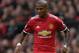 Manchester United's English midfielder Ashley Young controls the ball during the English Premier League football match between Manchester United and Crystal Palace at Old Trafford in Manchester, north west England, on September 30, 2017. / AFP PHOTO / Paul ELLIS / RESTRICTED TO EDITORIAL USE. No use with unauthorized audio, video, data, fixture lists, club/league logos or 'live' services. Online in-match use limited to 75 images, no video emulation. No use in betting, games or single club/league/player publications. / (Photo credit should read PAUL ELLIS/AFP/Getty Images)
