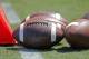Footballs sit on the turf ready for kick-off before the start of an NCAA football game between South Carolina and North Carolina State in Charlotte, N.C., Saturday, Sept. 2, 2017. South Carolina won 35-28. (AP Photo/Bob Leverone)