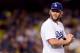 LOS ANGELES, CA - JUNE 20: Clayton Kershaw #22 of the Los Angeles Dodgers reacts to his wild pitch during the seventh inning against the Washington Nationals at Dodger Stadium on June 20, 2016 in Los Angeles, California. (Photo by Harry How/Getty Images)