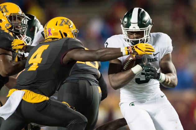 MINNEAPOLIS, MN - OCTOBER 14: LJ Scott #3 of the Michigan State Spartans carries the ball against Adekunle Ayinde #4 of the Minnesota Golden Gophers during the game on October 14, 2017 at TCF Bank Stadium in Minneapolis, Minnesota. The Spartans defeated the Gophers 30-27. (Photo by Hannah Foslien/Getty Images)