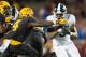 MINNEAPOLIS, MN - OCTOBER 14: LJ Scott #3 of the Michigan State Spartans carries the ball against Adekunle Ayinde #4 of the Minnesota Golden Gophers during the game on October 14, 2017 at TCF Bank Stadium in Minneapolis, Minnesota. The Spartans defeated the Gophers 30-27. (Photo by Hannah Foslien/Getty Images)