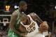 Cleveland Cavaliers' LeBron James, right, tries to get past Boston Celtics' Kyrie Irving in the second half of an NBA basketball game, Tuesday, Oct. 17, 2017, in Cleveland. The Cavaliers won 102-99. (AP Photo/Tony Dejak)