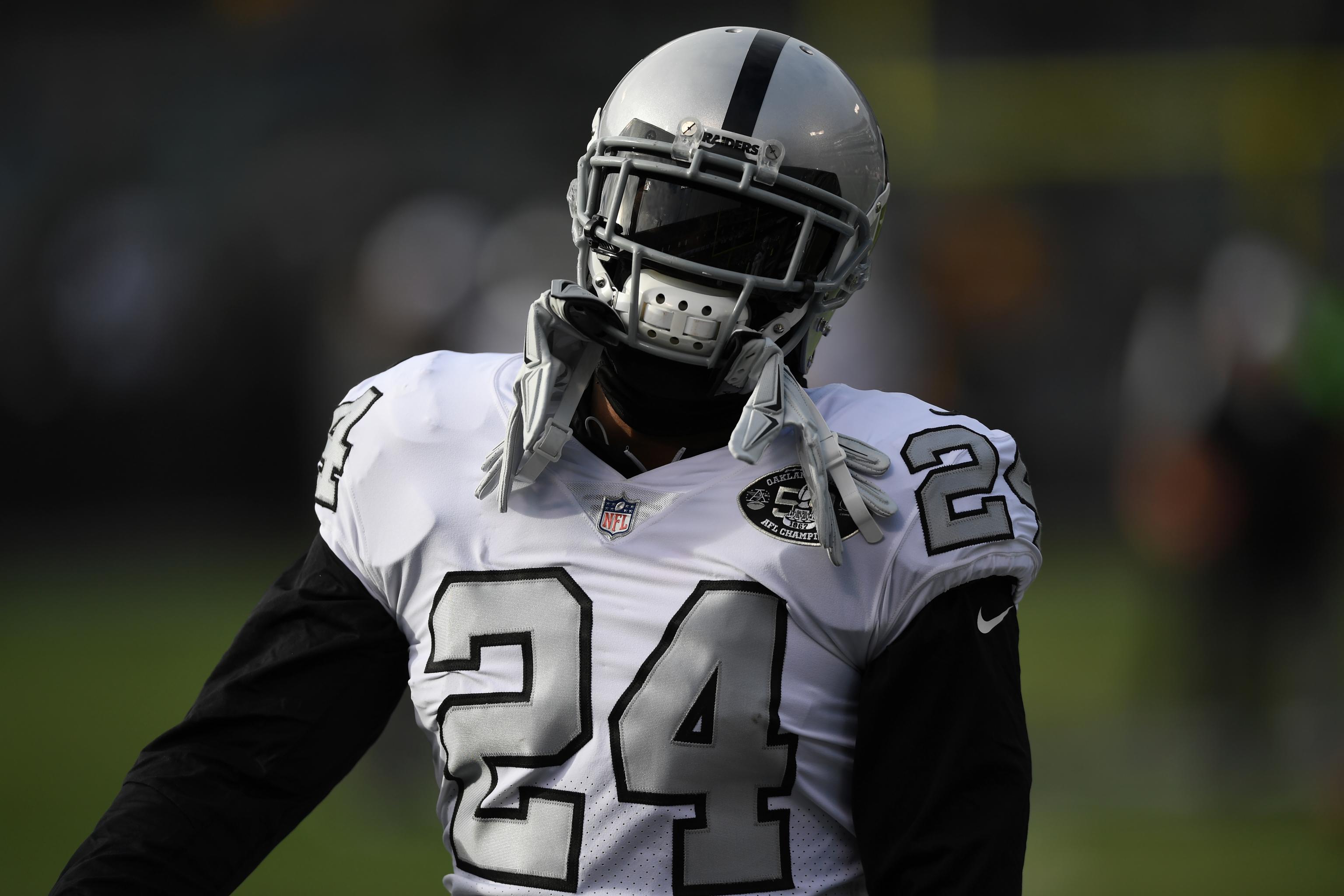 Oakland Raiders running back Marshawn Lynch (24) is stopped by