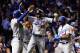 CHICAGO, IL - OCTOBER 19: Enrique Hernandez #14 of the Los Angeles Dodgers celebrates with teammates after hitting a grand slam in the third inning against the Chicago Cubs during game five of the National League Championship Series at Wrigley Field on October 19, 2017 in Chicago, Illinois. (Photo by Jamie Squire/Getty Images)