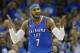 Oklahoma City Thunder forward Carmelo Anthony (7) gestures after hitting a three-point basket in the second quarter of an NBA basketball game against the New York Knicks in Oklahoma City, Thursday, Oct. 19, 2017. (AP Photo/Sue Ogrocki)