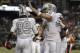 Oakland Raiders wide receiver Amari Cooper (89) and quarterback Derek Carr (4) celebrate after connecting on a touchdown pass against the Kansas City Chiefs during the first half of an NFL football game in Oakland, Calif., Thursday, Oct. 19, 2017. (AP Photo/Marcio Jose Sanchez)