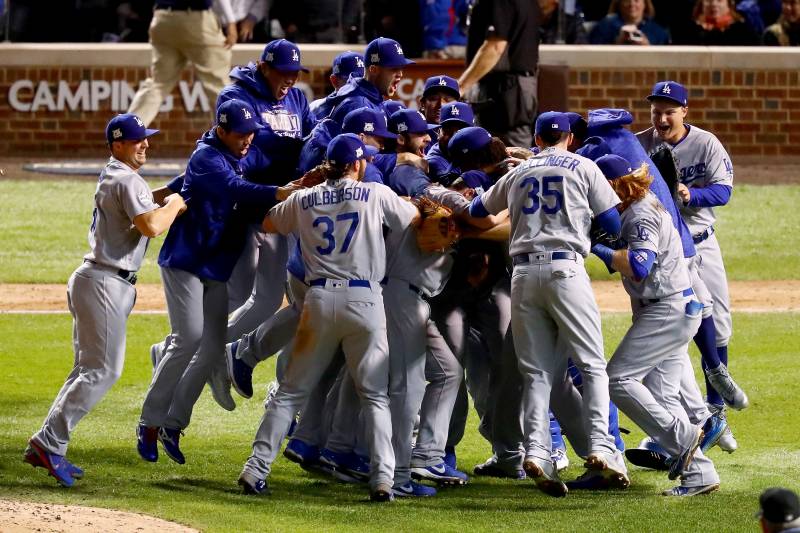 CHICAGO, IL - OCTOBER 19:  The Los Angeles Dodgers celebrate defeating the Chicago Cubs 11-1 in game five of the National League Championship Series at Wrigley Field on October 19, 2017 in Chicago, Illinois. The Dodgers advance to the 2017 World Series.  (Photo by Stacy Revere/Getty Images)