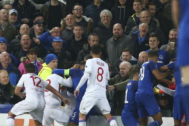 Everton, in blue, and Lyon players clash during a Group E Europa League soccer match between Everton F.C. and Olympique Lyon at Goodison Park Stadium, Liverpool, England, Thursday Oct. 19, 2017. (AP Photo/Dave Thompson)