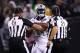 OAKLAND, CA - OCTOBER 19: Marshawn Lynch #24 of the Oakland Raiders is restrained after coming off the bench and shoving a referee during a scrum with the Kansas City Chiefs in their NFL game at Oakland-Alameda County Coliseum on October 19, 2017 in Oakland, California. Lynch was ejected for unsportsmanlike conduct. (Photo by Ezra Shaw/Getty Images)