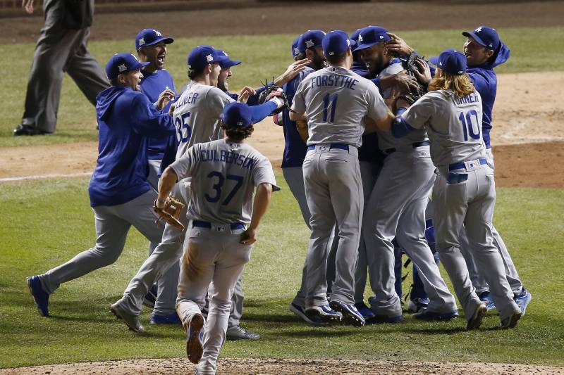 The Dodgers celebrate after winning the National League pennant Thursday night.