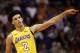 Los Angeles Lakers guard Lonzo Ball gestures to teammates during the first half of an NBA basketball game against the Phoenix Suns, Friday, Oct. 20, 2017, in Phoenix. (AP Photo/Matt York)