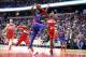 WASHINGTON, DC - OCTOBER 20: Reggie Jackson #1 of the Detroit Pistons puts up a shot between John Wall #2 and Bradley Beal #3 of the Washington Wizards in the first half at Capital One Arena on October 20, 2017 in Washington, DC. NOTE TO USER: User expressly acknowledges and agrees that, by downloading and or using this photograph, User is consenting to the terms and conditions of the Getty Images License Agreement. (Photo by Rob Carr/Getty Images)