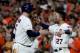 HOUSTON, TX - OCTOBER 21: Brian McCann #16 and Jose Altuve #27 of the Houston Astros celebrate after hitting a double to right field to score Carlos Correa #1 and Yuli Gurriel #10 against Tommy Kahnle #48 of the New York Yankees during the fifth inning in Game Seven of the American League Championship Series at Minute Maid Park on October 21, 2017 in Houston, Texas. (Photo by Elsa/Getty Images)