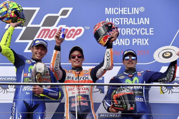 Race winner Spain's Marc Marquez, centre, stands on the podium with second placed Italy's Valentino Rossi, left, and third placed Spain's Maverick Vinales, right, after winning the Australian Motorcycle Grand Prix at Phillip Island near Melbourne, Australia, Sunday, Oct. 22, 2017. (AP Photo/Andy Brownbill)