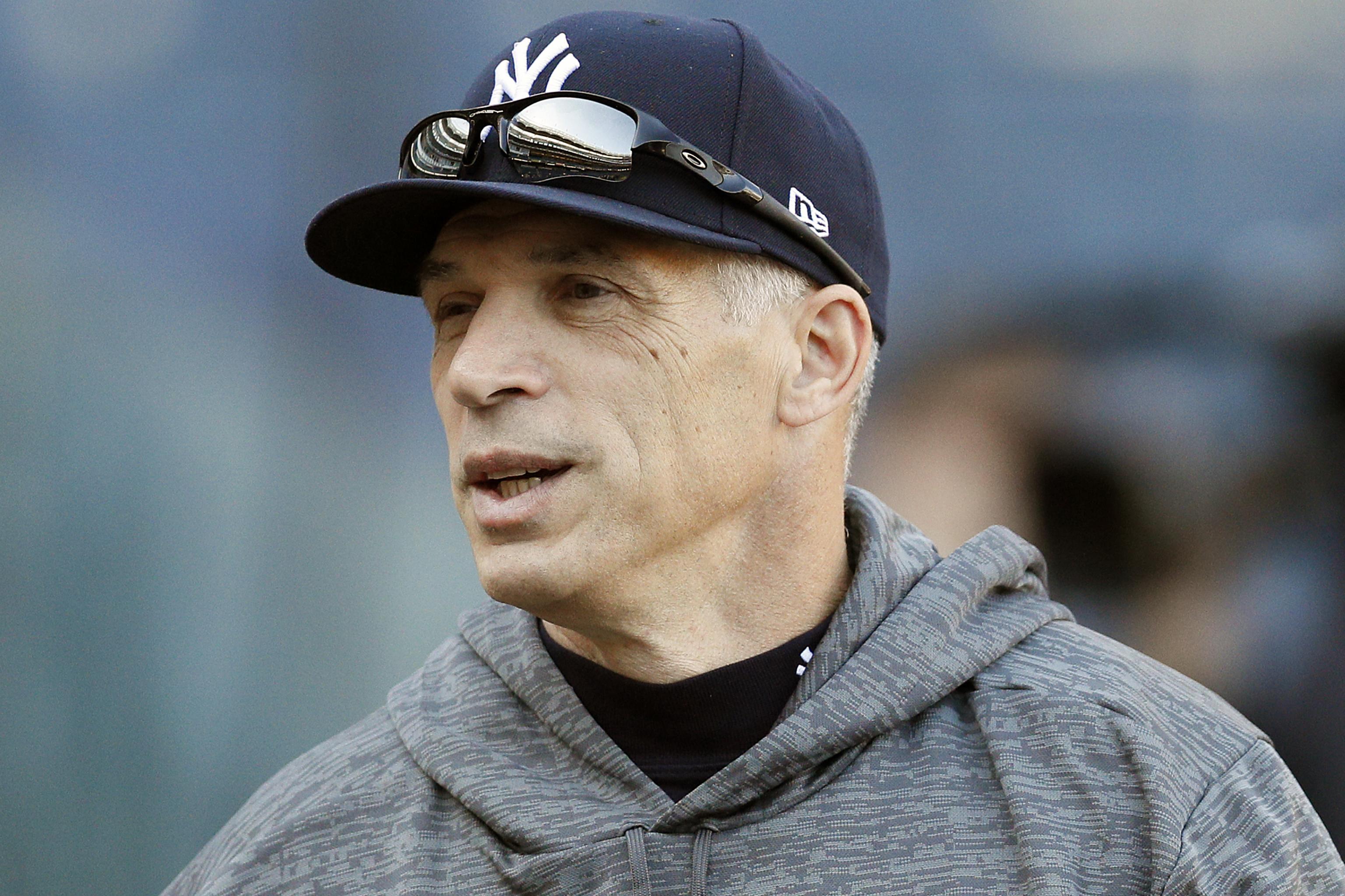 New York Yankees Manager Joe Girardi stands with Masahiro Tanaka in his new  Yankee hat and jersey at a press conference at Yankee Stadium in New York  City on February 11, 2014.