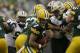 Green Bay Packers quarterback Brett Hundley (7) tries to run from New Orleans Saints defense during the second half of an NFL football game, Sunday, Oct. 22, 2017, in Green Bay, Wis. (AP Photo/Jeffrey Phelps)