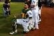OAKLAND, CA - SEPTEMBER 25: Bruce Maxwell #13 of the Oakland Athletics kneels during the national anthem before the game against the Seattle Mariners at the Oakland Coliseum on September 25, 2017 in Oakland, California. The Seattle Mariners defeated the Seattle Mariners 7-1. (Photo by Jason O. Watson/Getty Images)