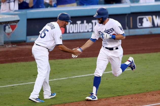 LOS ANGELES, CA - OCTOBER 24:  Chris Taylor #3 of the Los Angeles Dodgers celebrates with third base coach Chris Woodward after hitting a solo home run during the first inning against the Houston Astros in game one of the 2017 World Series at Dodger Stadium on October 24, 2017 in Los Angeles, California.  (Photo by Christian Petersen/Getty Images)