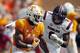 Tennessee running back John Kelly (4) runs for yardage as South Carolina defensive lineman D.J. Wonnum (8) chases in the first half of an NCAA college football game Saturday, Oct. 14, 2017, in Knoxville, Tenn. (AP Photo/Wade Payne)