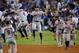 LOS ANGELES, CA - OCTOBER 25: George Springer #4 and Carlos Correa #1 of the Houston Astros celebrate after defeating the Los Angeles Dodgers 7-6 in eleven innings to win game two of the 2017 World Series at Dodger Stadium on October 25, 2017 in Los Angeles, California. (Photo by Ezra Shaw/Getty Images)