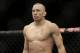 Georges St. Pierre, of Canada, waits to begin a UFC 167 mixed martial arts championship welterweight bout against Johny Hendricks on Saturday, Nov. 16, 2013, in Las Vegas. St. Pierre won by split decision. (AP Photo/Isaac Brekken)