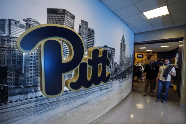 People walk out of the Panther Store at the Petersen Events Center at the University of Pittsburgh before a presentation announcing the use of the classic