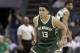 Milwaukee Bucks' Malcolm Brogdon (13) waits to guard a Charlotte Hornets player in the second half of an NBA basketball game in Charlotte, N.C., Tuesday, March 28, 2017. The Bucks won 118-108. (AP Photo/Chuck Burton)