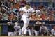 Miami Marlins' Giancarlo Stanton runs after hitting a single during the first inning of a baseball game against the Atlanta Braves, Sunday, Oct. 1, 2017, in Miami. (AP Photo/Lynne Sladky)