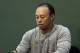 FILE - In this March 20, 2017, file photo, golfer Tiger Woods prepares to sign copies of his new book at a book signing in New York. Police say golf great Tiger Woods has been arrested on a DUI charge in Florida. The Palm Beach County Sheriff's Office says on its website that Woods was booked into a county jail around 7 a.m. on Monday, May 29, 2017. (AP Photo/Seth Wenig, File)