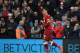 Liverpool's Brazilian midfielder Roberto Firmino celebrates after scoring their second goal with this header during the English Premier League football match between Liverpool and Huddersfield Town at Anfield in Liverpool, north west England on October 28, 2017. / AFP PHOTO / Paul ELLIS / RESTRICTED TO EDITORIAL USE. No use with unauthorized audio, video, data, fixture lists, club/league logos or 'live' services. Online in-match use limited to 75 images, no video emulation. No use in betting, games or single club/league/player publications. / (Photo credit should read PAUL ELLIS/AFP/Getty Images)