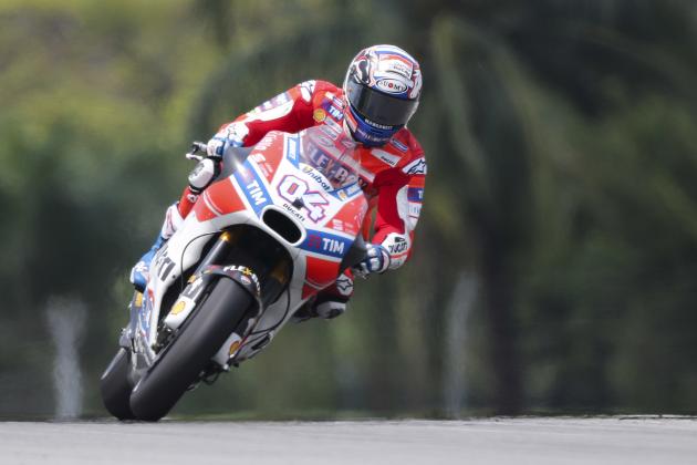Italy's MotoGP rider Andrea Dovizioso steers his Ducati during the qualifying session of the Malaysia MotoGP at the Sepang International circuit in Sepang, Malaysia, Saturday, Oct. 28, 2017. (AP Photo/Vincent Phoon)