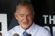Atlanta Braves President of Baseball Operations John Hart, center, talks with reporters in the dugout before a baseball game against the Pittsburgh Pirates in Pittsburgh, Tuesday, May 17, 2016. (AP Photo/Gene J. Puskar)