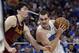 Orlando Magic's Mario Hezonja, right, drives around Cleveland Cavaliers' Cedi Osman during the second half of an NBA preseason basketball game, Friday, Oct. 13, 2017, in Orlando, Fla. Cleveland won 113-106. (AP Photo/John Raoux)