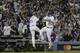 Los Angeles Dodgers' Joc Pederson celebrates his home run with third base coach Chris Woodward during the seventh inning of Game 6 of baseball's World Series against the Houston Astros Tuesday, Oct. 31, 2017, in Los Angeles. (AP Photo/David J. Phillip)