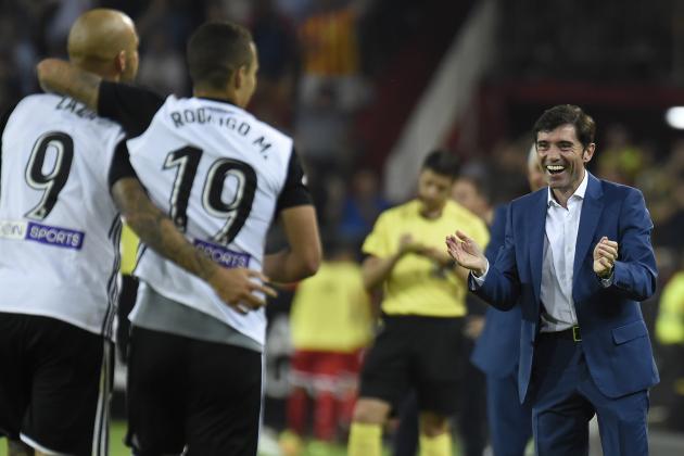 Valencia's coach Marcelino (R) celebrates his team's goal during the Spanish league football match Valencia CF vs Sevilla FC at the Mestalla stadium in Valencia on October 21, 2017. / AFP PHOTO / JOSE JORDAN        (Photo credit should read JOSE JORDAN/AFP/Getty Images)