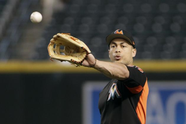 Miami Marlins' Giancarlo Stanton catches a ball before a baseball game against the Arizona Diamondbacks, Friday, Sept. 22, 2017, in Phoenix. (AP Photo/Ralph Freso)