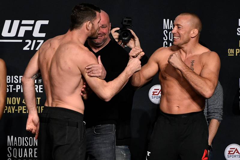 NEW YORK, NY - NOVEMBER 03: (L-R) Michael Bisping of England and Georges St-Pierre of Canada face off during the UFC 217 weigh-in inside Madison Square Garden on November 3, 2017 in New York City. (Photo by Jeff Bottari/Zuffa LLC/Zuffa LLC via Getty Images)