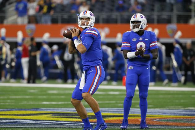 Florida quarterback Feleipe Franks (13) prepares to pass as quarterback Malik Zaire (8) watches during warm ups before an NCAA college football game against Michigan on Saturday, Sept. 2, 2017, in Arlington, Texas. (AP Photo/Tony Gutierrez)