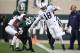 EAST LANSING, MI - NOVEMBER 04: Jonathan Holland #18 of the Penn State Nittany Lions tries for extra yards before going out of bounds while playing the Michigan State Spartans at Spartan Stadium on November 4, 2017 in East Lansing, Michigan. (Photo by Gregory Shamus/Getty Images)