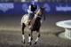Exercise rider Angel Garcia rides Gun Runner during morning workouts before the Breeders Cup horse races Thursday, Nov. 2, 2017, in Del Mar, Calif. Del Mar is hosting the $28 million, 13-race Breeders' Cup for the first time. The season-ending championships open with four races on Friday followed by nine, including the Classic, on Saturday. (AP Photo/Gregory Bull)