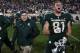 EAST LANSING, MI - NOVEMBER 04: Matt Sokol #81 of the Michigan State Spartans celebrates a 27-24 win over the Penn State Nittany Lions next to head coach Mark Dantonio at Spartan Stadium on November 4, 2017 in East Lansing, Michigan. (Photo by Gregory Shamus/Getty Images)