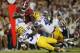 Alabama wide receiver Calvin Ridley is tackled by LSU linebacker Donnie Alexander, and safety Grant Delpit, left, during the second half of an NCAA college football game, Saturday, Nov. 4, 2017, in Tuscaloosa, Ala. (AP Photo/Brynn Anderson)