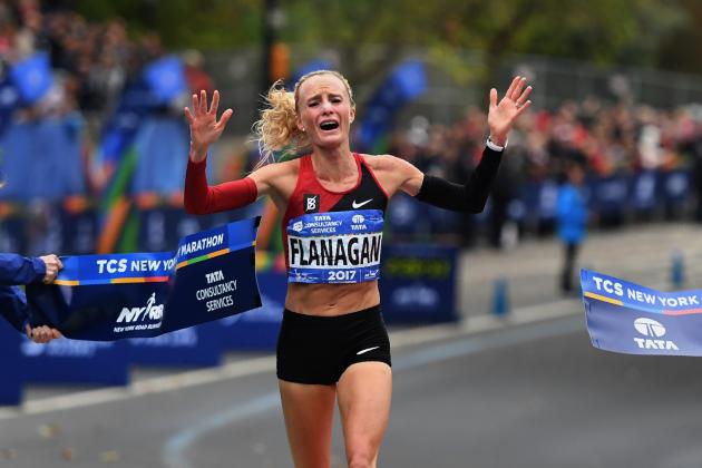 Shalane Flanagan of the US reacts after crossing the finish line to win the Women's  Division during the 2017 TCS New York City Marathon in New York on November 5, 2017. 
Five days after the worst attack on New York since September 11, 2001, the city is staging a show of defiance on November 5, as 50,000 runners from around the world are set to participate in the New York Marathon, under heavy security. / AFP PHOTO / TIMOTHY A. CLARY        (Photo credit should read TIMOTHY A. CLARY/AFP/Getty Images)